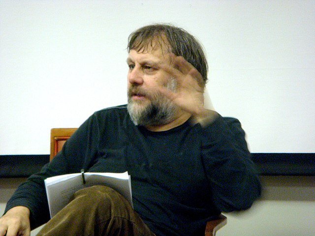 Here, Slavoj Zizek is in the midst of an address at Liverpool John Moores University in England. Photo Credit: Andy Miah from Liverpool, UK, CC BY-SA 2.0 , via Wikimedia Commons
