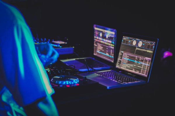 As AI takes the stage in the music industry, it’s not just playing the old tunes. It’s composing a new symphony, conducting patterns in data, and orchestrating a harmony between technology and creativity. But as the music wanes, questions about originality and copyright strike a dissonant chord. (Photo Credit: Feliphe Schiarolli / Unsplash)
