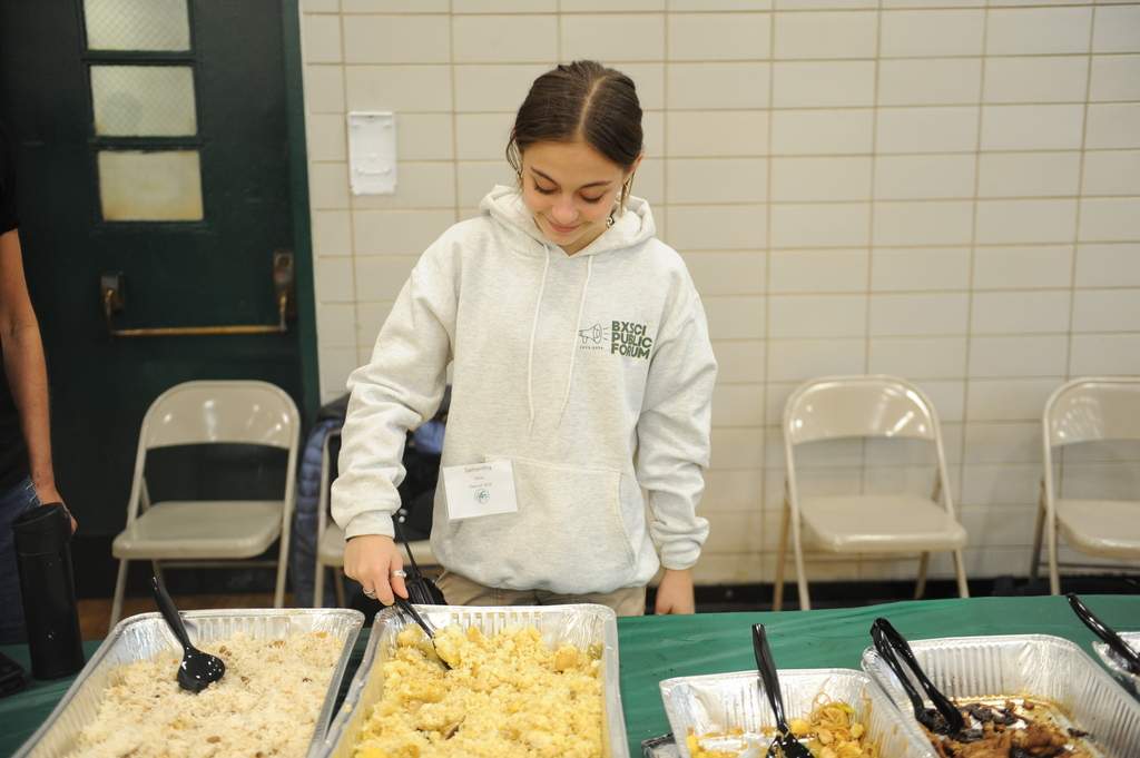 Here is Public Forum Speech & Debate captain Sam Zaino ’24 working at the Big Bronx Debate tournament in October 2023, helping to serve food to judges and tournament competitors from other schools.
