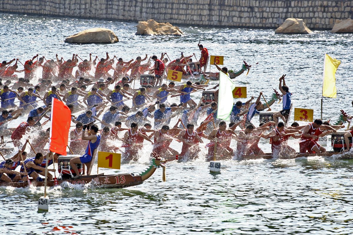 From its ancient roots to today, the sport of Dragon Boat Racing has evolved into a captivating sport that seamlessly blends both ferocity and fitness. (Photo Credit: I, Iidxplus, CC BY-SA 3.0 , via Wikimedia Commons)
