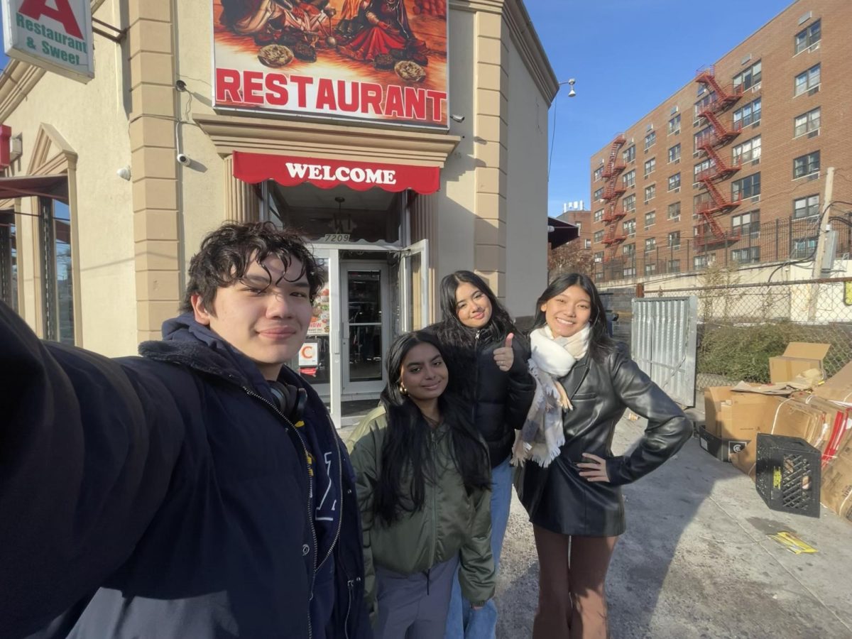 From left to right are Bronx Science students Sinan Roumie 24, Umme Anushka 24, Jazmine Pawar 24, and me, Saldon Tenzin 24, outside of our first stop on the food crawl, Dera Restaurant. (Photo provided by Saldon Tenzin)