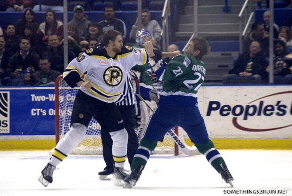 The first documented hockey fight took place in 1890. The tradition has stuck since then. In this photo from 2011, over a century after the first fight, Lane MacDermid (in white) squares up against Jared Nightingale (in green). (Photo credit: Sarah Connors, CC BY 2.0 , via Wikimedia Commons)