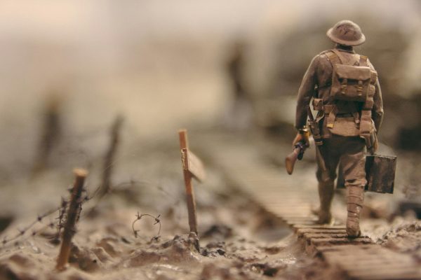 A soldier, defeated yet empowered, charts the endless road back home. (Photo Credit: Stijn Swinnen / Unsplash)