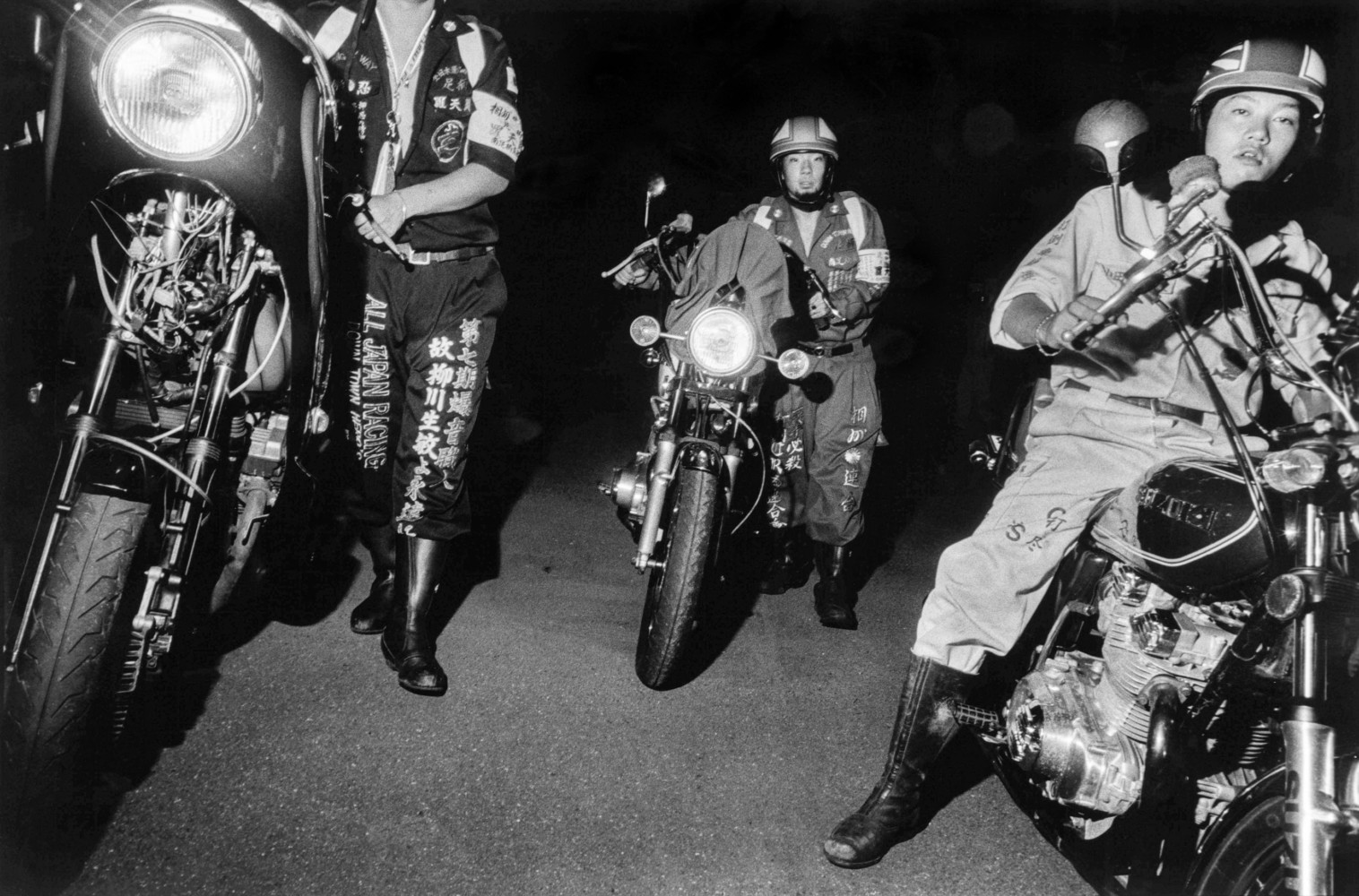 Bikers abandon a motorcycle meeting while being pursued by police. (Photo Credit: Kamonomiya. Japan. 1999. © Bruce Gilden | Magnum Photos; used by permission)