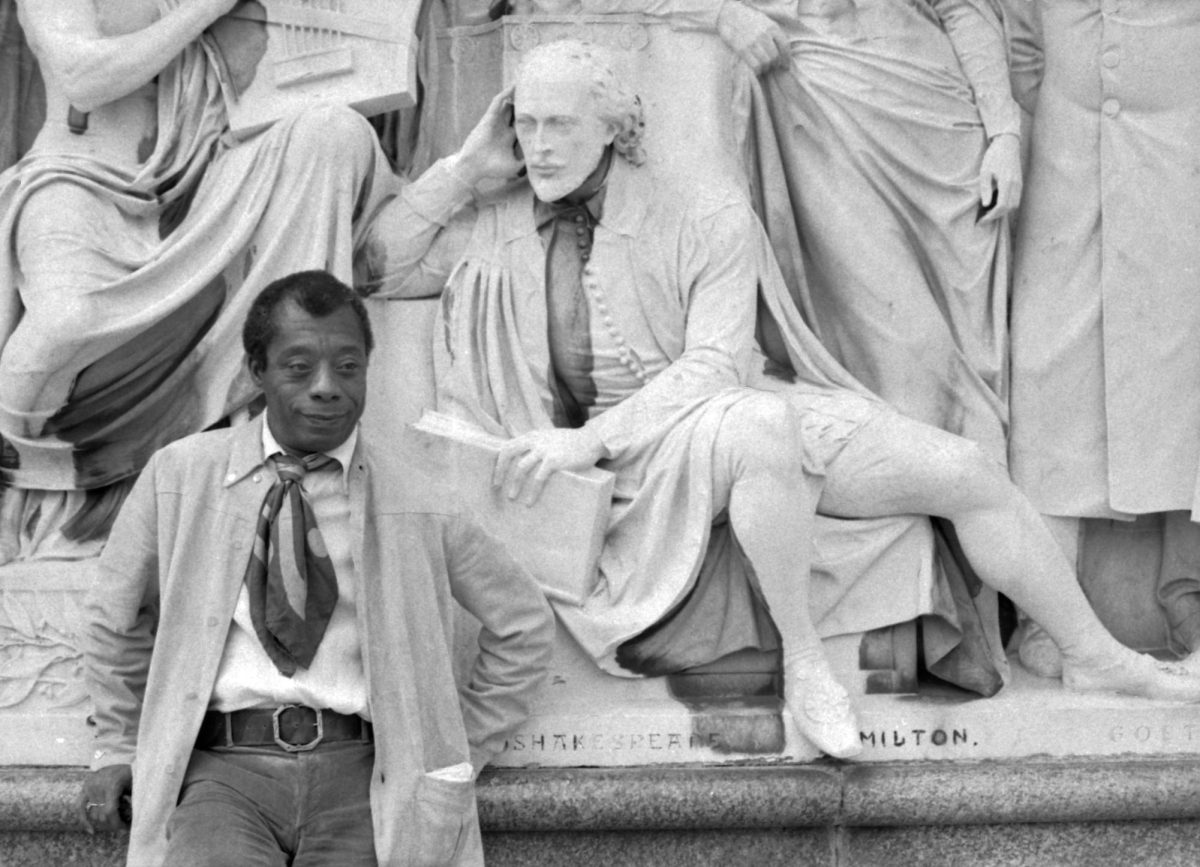 James+Baldwin+traveled+to+London+in+1968%3B+here%2C+he+is+pictured+at+the+Albert+Memorial+next+to+a+statue+of+William+Shakespeare%2C+a+key+figure+in+the+traditional+Western+canon.+%28Photo+Credit%3A+Allan+warren%2C+CC+BY-SA+3.0+%2C+via+Wikimedia+Commons%29