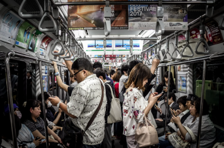 Here is a real-life scenario of phone addiction within New York City’s subways, displaying how bewitching phones have become in our society.  (Photo Credit: Hugh Han / Unsplash)
