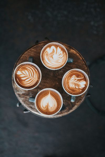 Coffee is one of the world’s most beloved and cherished beverages. Its complex flavors and invigorating aroma weave a long tapestry of history and culture from across the globe. (Photo Credit: Nathan Dumlao / Unsplash) 