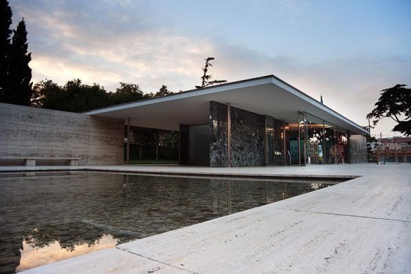 The Barcelona Pavilion is a perfect example of minimalist architecture, exhibiting many of the characteristics that make minimalist buildings appear sleek and refined. (Photo Credit: Ashley Pomeroy at English Wikipedia, CC BY 3.0 , via Wikimedia Commons)