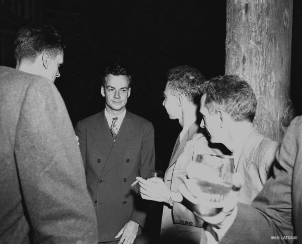 Feynman’s real role in the Manhattan Project was deeper than he liked to suggest in his memoirs. Here he speaks with Robert Oppenheimer, the director of the Manhattan Project’s Los Alamos Laboratory, who is often called the “father of the atomic bomb.” (Unknown author, Public domain, via Wikimedia Commons)