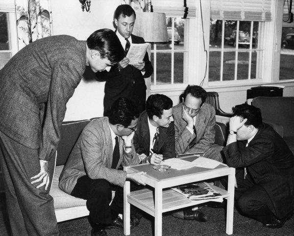 By the 1940s, physicists were applying new theories to a framework within which to study the properties of fundamental particles and the relationship between gravity, electromagnetism and the forces that bind the atom together. Here, Richard Feynman, Julian Schwinger, and other physicists surround a table at the 1947 Shelter Island Conference. (AIP Emilio Segrè Visual Archives, Gift of Abraham Pais, via Wikimedia Commons)