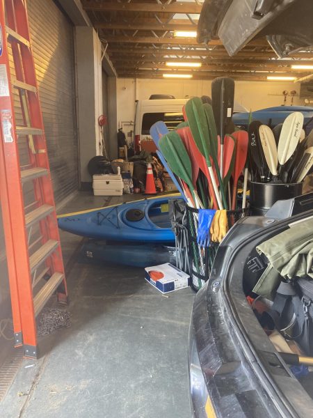 This is a view inside the shed at the Bronx River House — you can see cars, kayaks, paddles, and more.