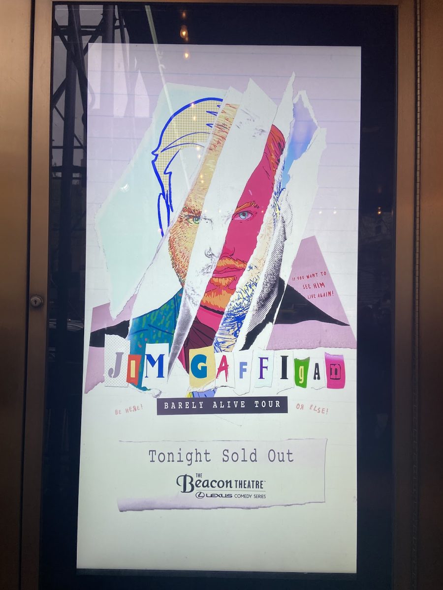 Outside the Beacon Theater, Jim Gaffigan’s poster for the tour is featured.