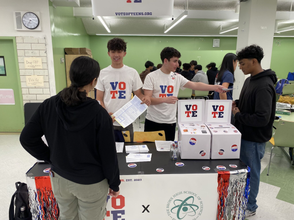 Oscar Allen 25 and Sebastian Merkatz 25 hand out Voter Registration cards as a part of their Pre-Registration Drive at Bronx Science this past April 2024. 
