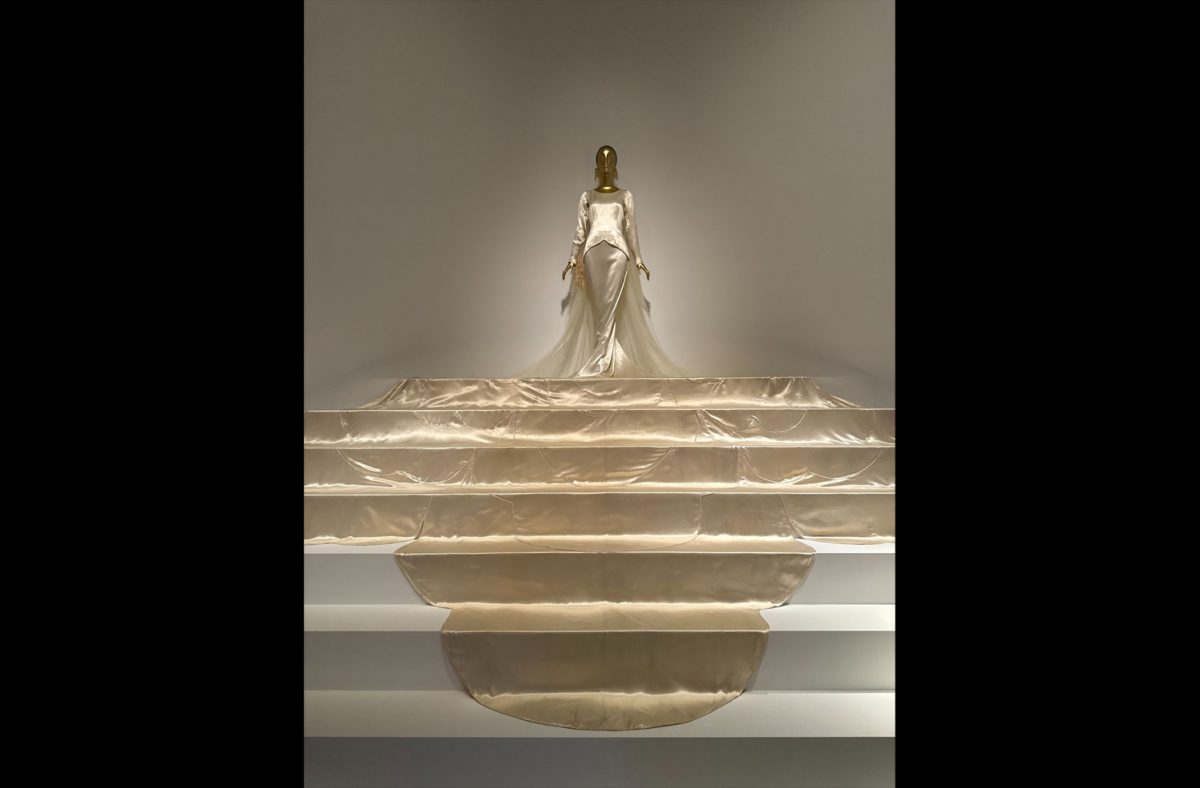 The showstopper dress that concludes the exhibit serves the purpose of a wedding dress made out of cellulose, silk, satin and lace, and was a gift to the Met from the Brooklyn Museum. 