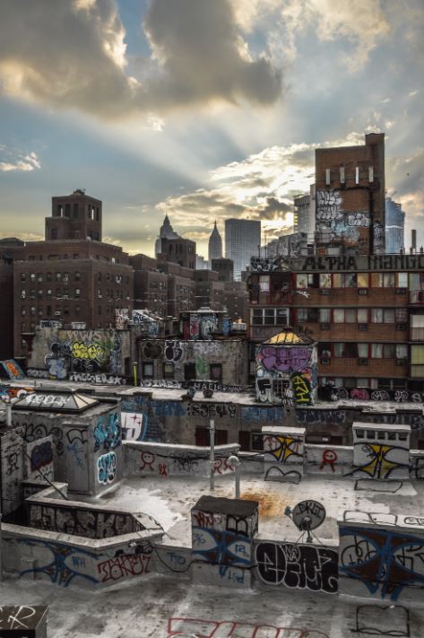 The rooftops of New York City buildings are a lesser known location for graffiti artists to leave their mark. (Photo Credit: Alice Pasqual / Unsplash)