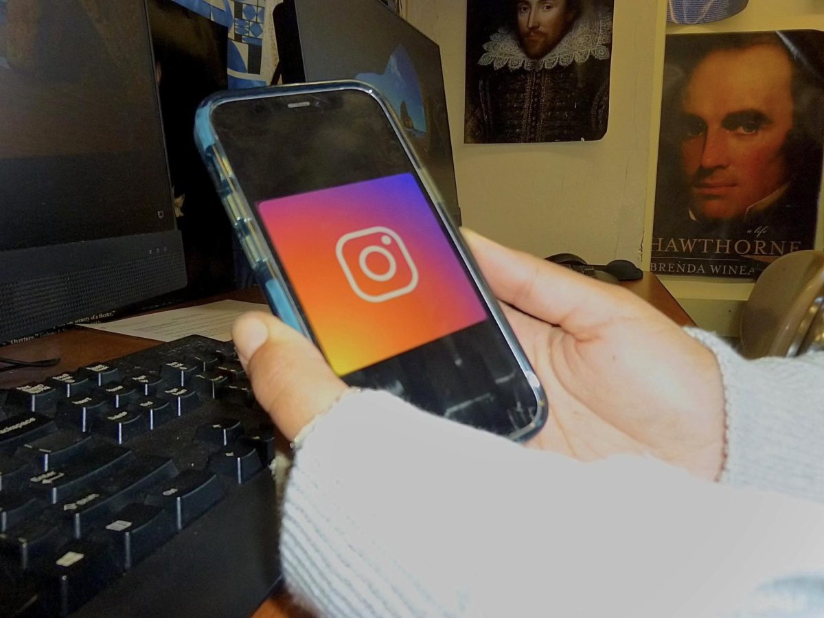 In a classroom, a student opens Instagram on her phone. As social media becomes a more prevalent aspect of our lives, it’s becoming increasingly difficult to detach ourselves from the online world.