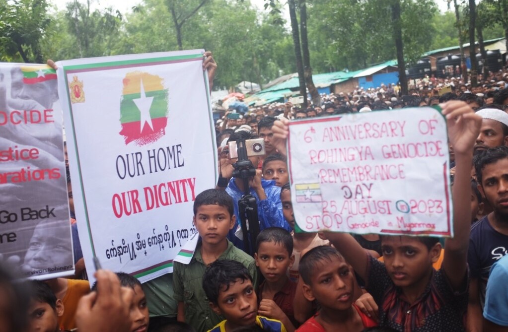 Here, Rohingya refugees honor the lives lost in the Rohingya Genocide in Cox's Bazar, Bangladesh, 2023. (Photo Credit: Md. Jamal / VOA, Public domain, via Wikimedia Commons)