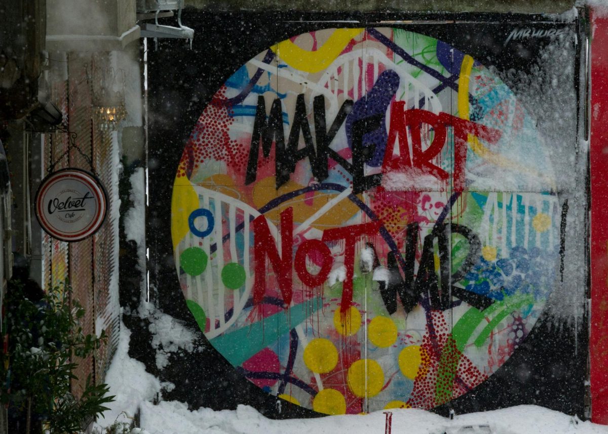 An unapologetic shout from the streets: 'Make Art Not War.' This work of graffiti isn’t just painted on a wall; it’s a call for peace in a world often too focused on conflict. Art becomes the rebellion, and the message is loud, raw, and impossible to ignore. (Photo Credit: Randy Tarampi / Unsplash)