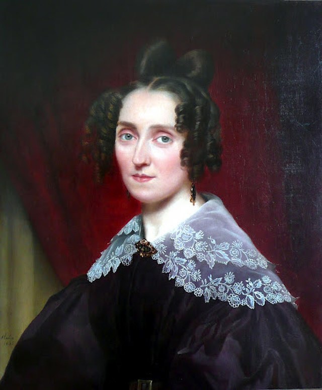 This portrait of Louise Farrenc, painted by Luigi Rubio, captures the composer in a moment of reflection, embodying her dedication and quiet strength as a pioneering figure in 19th-century music. (Image Credit: Luigi Rubio, Public domain, via Wikimedia Commons)