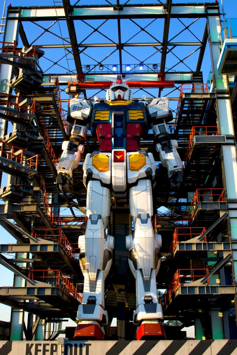 Pictured is the full scale RX-78-2 Gundam docked, standing still at its docking bay in Gundam Factory Yokohama. (Photo Credit: Yuta Koike (@yuta129)/Unsplash)