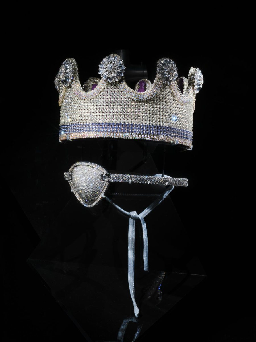 Displayed here is Slick Rick's Crown and Eye Patch. The piece, designed by Rick himself, embraces grandeur and royalty in his iconic style. This costume jewelry piece is by Tanya Jones of Lucki Crowns. (Alvaro Keding/© AMNH). 