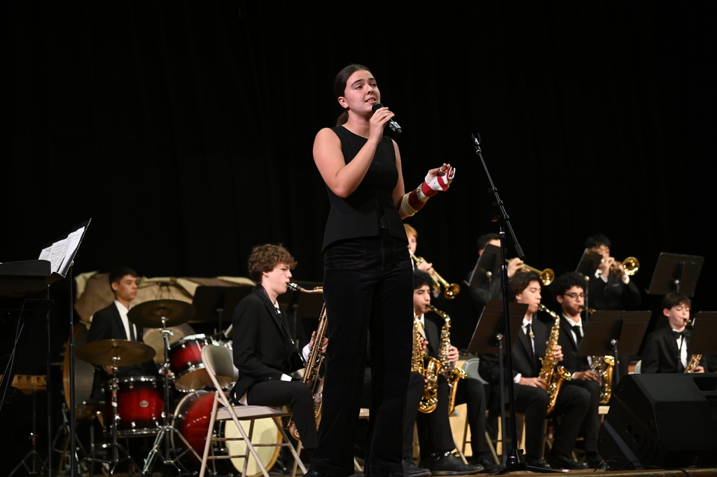Cece Beachaump ‘25 sings with the jazz band during their penultimate song, 'Girl From Ipanema.'