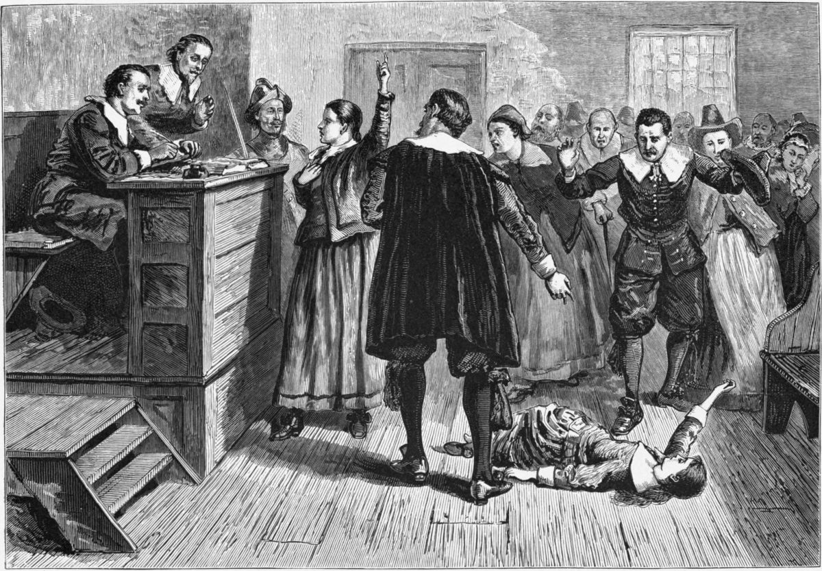 The image above is an illustration of the courtroom in the Salem Witch trials. A woman (the accused) on the floor is being pointed at, while the other woman (standing up) has been called as a witness. Such dramatic moments, particularly the use of 'spectral evidence,' were a feature of certain trials, though the exact legal proceedings and events varied widely in different times and places. (Image Credit: Public domain, via Wikimedia Commons)
