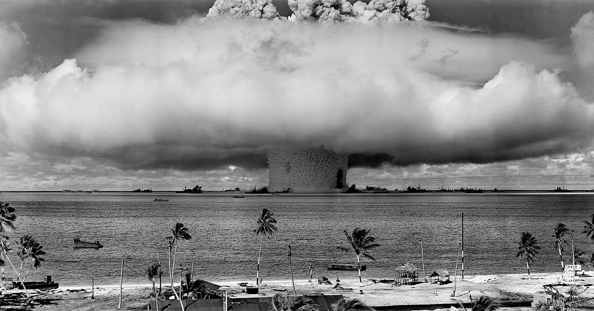 Pictured is a United States nuclear bomb test at the Bikini Atoll in 1946, at the beginning of the Cold War. (Photo Credit: Original: United States Department of Defense (either the U.S. Army or the U.S. Navy); Derivative work:  Victorrocha, Public domain, via Wikimedia Commons)