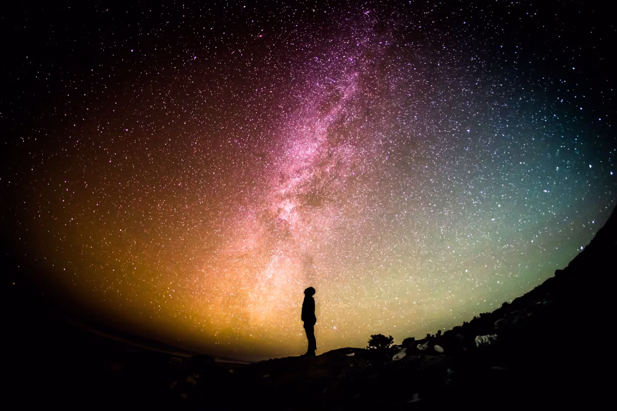 Gazing at the stars offers perspective, as it serves as a reminder of both our smallness and our significance. (Photo Credit: Greg Rakozy / Unsplash)