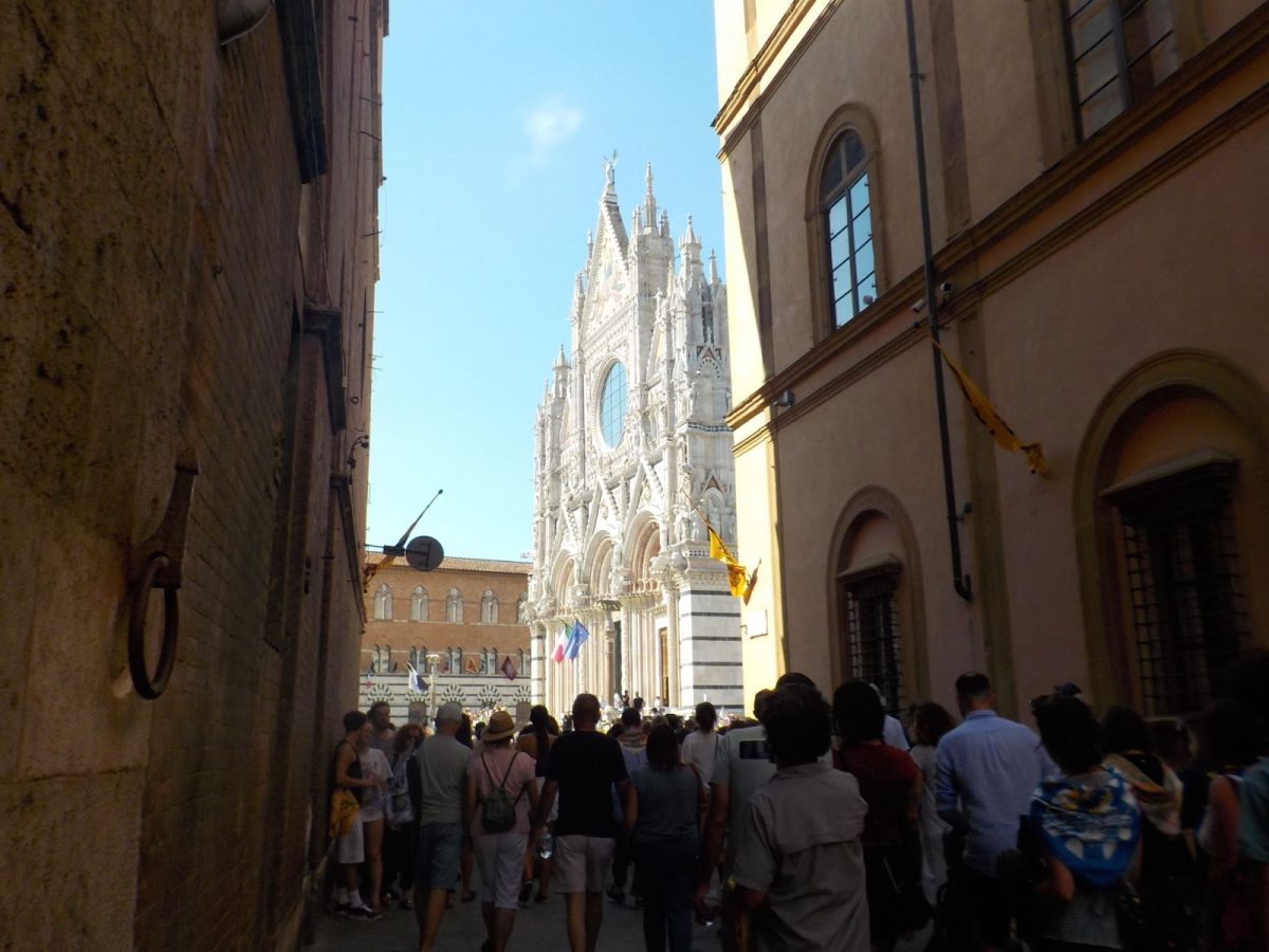 This might be the most breathtaking sight in the entire city: the Duomo di Siena. As you emerge from the Via di Città, the street on which I was walking as I took this picture, you get a picturesque view of the church, where its pale brightness stands in stark contrast against the dark red and brown buildings around it.