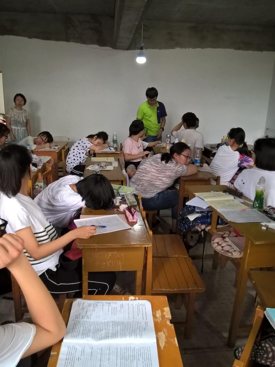 Here, students fall asleep during their tutoring class. (Photo Credit: Kychn, CC BY-SA 4.0 , via Wikimedia Commons)