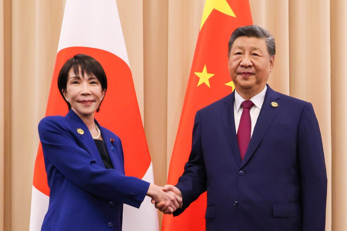 Japanese Prime Minister Sanae Takaichi and Chinese President Xi Jinping shake hands ahead of the APEC Summit in Gyeongju, South Korea, on October 31st, 2025. This meeting was their first in-person encounter since Takaiichi took office and occurred amid strained relations over the issue of Taiwan. (Photo Credit: 首相官邸ホームページ, CC BY 4.0 , via Wikimedia Commons)