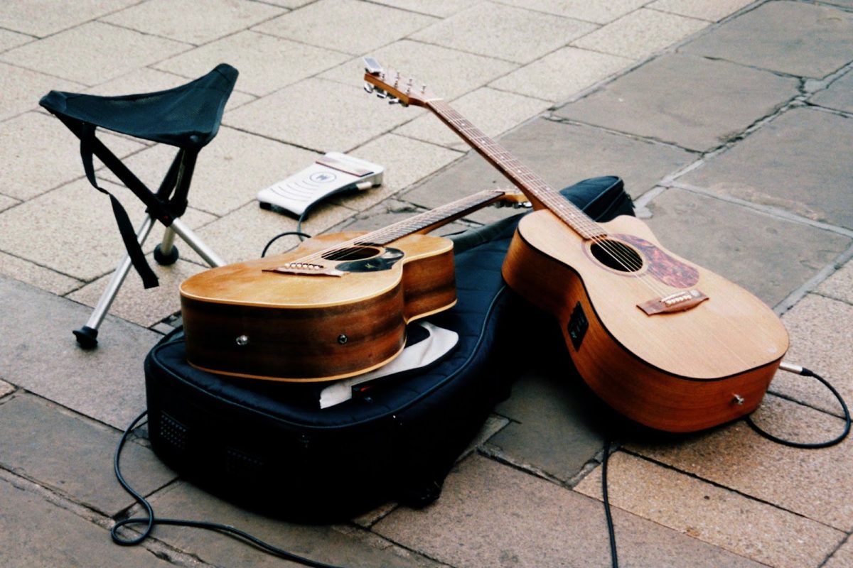 A common instrument used by performers on the subway is the guitar. (Photo Credit: Nick Page / Unsplash)