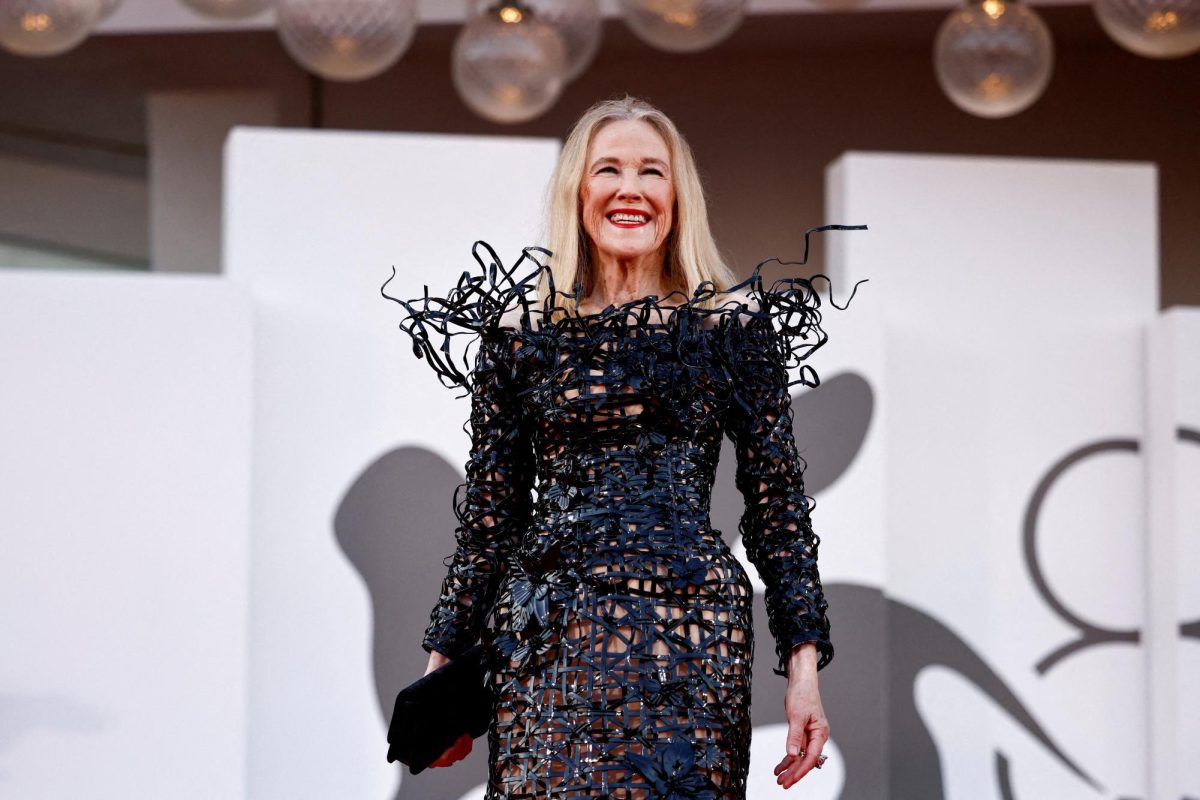 Pictured is Catherine O’Hara smiling on the red carpet for the opening of 'Beetlejuice Beetlejuice' (2024), showcasing her signature elegance and individuality on film and television. (Photo Credit: REUTERS/via SNO Sites/Yara Nardi)