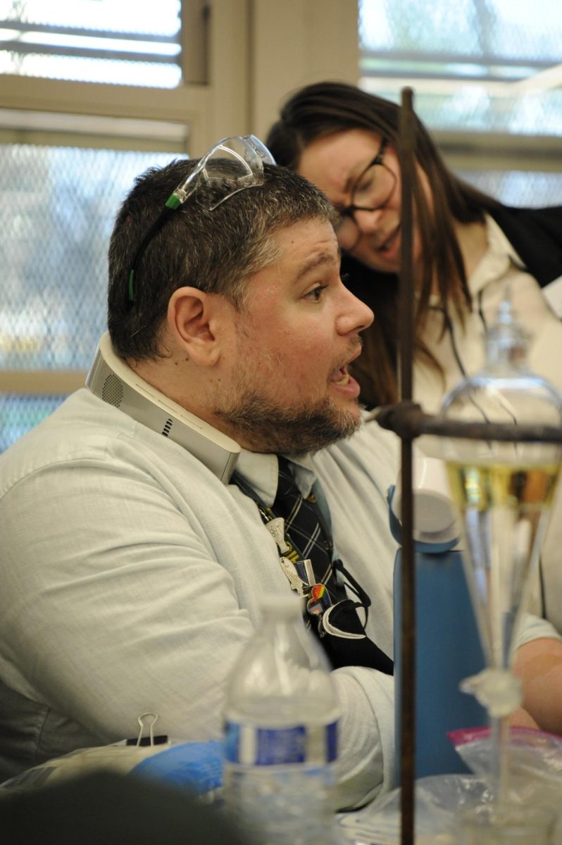 Mr. Scheiber, a chemistry teacher, explains more about the Bronx Science chemistry courses to parents. 