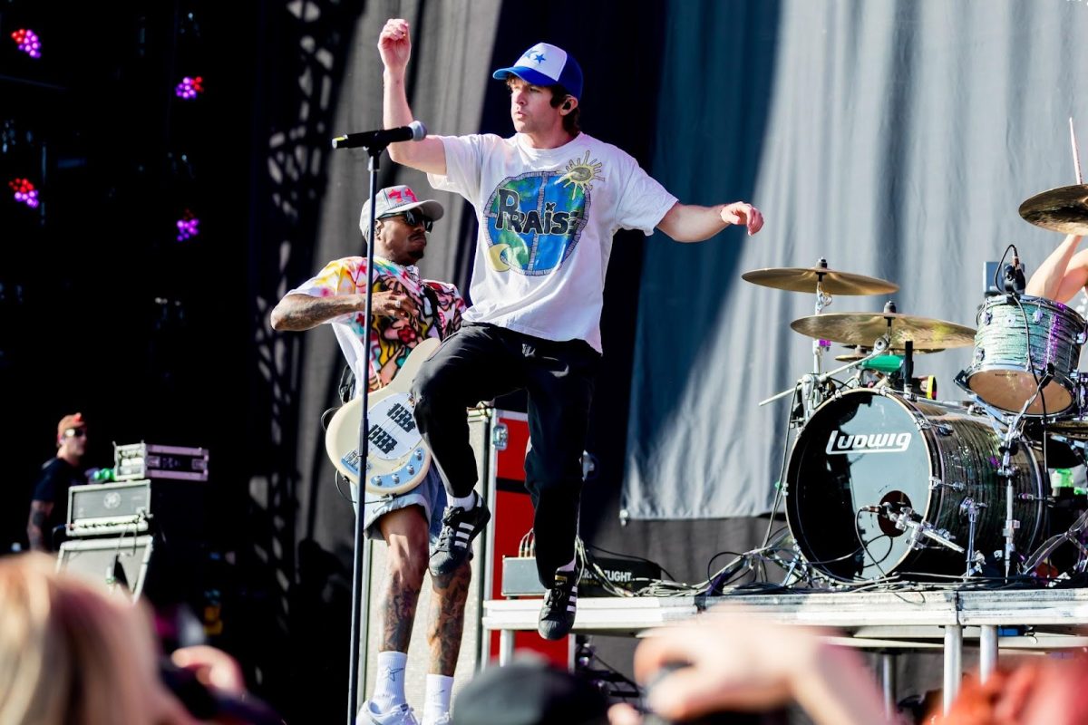 Pictured is 'Turnstile'performed in Nürburgring, Germany at the Rock am Ring festival in June of 2023. Pictured in the center is Turnstile’s singer Brendan Yates, and behind him is their bassist Franz Lyons. The band is very well known for their energetic live shows, illustrated here by Yates' jumping. (Photo Credit: Sven Mandel, CC BY-SA 4.0 , via Wikimedia Commons)